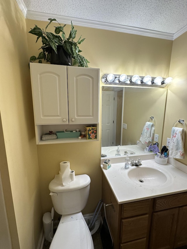 1140 Brittany Park Ln, Antioch, TN 37013 - bathroom with vanity, crown molding, a textured ceiling, and toilet