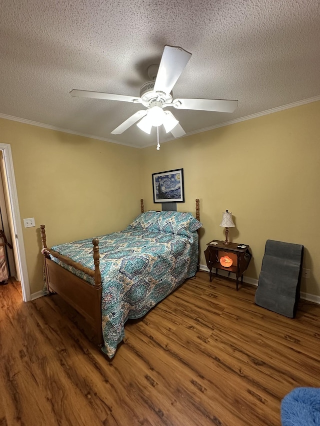 1140 Brittany Park Ln, Antioch, TN 37013 - bedroom with wood finished floors, a textured ceiling, ornamental molding, a ceiling fan, and baseboards