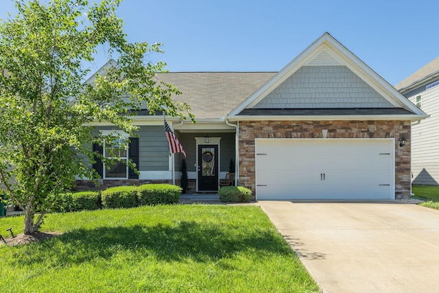 979 Carnation Dr, Spring Hill, TN 37174 - craftsman house with a front yard, stone siding, driveway, an attached garage, and roof with shingles
