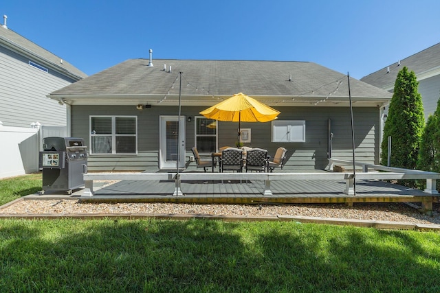 979 Carnation Dr, Spring Hill, TN 37174 - back of property with a deck and roof with shingles