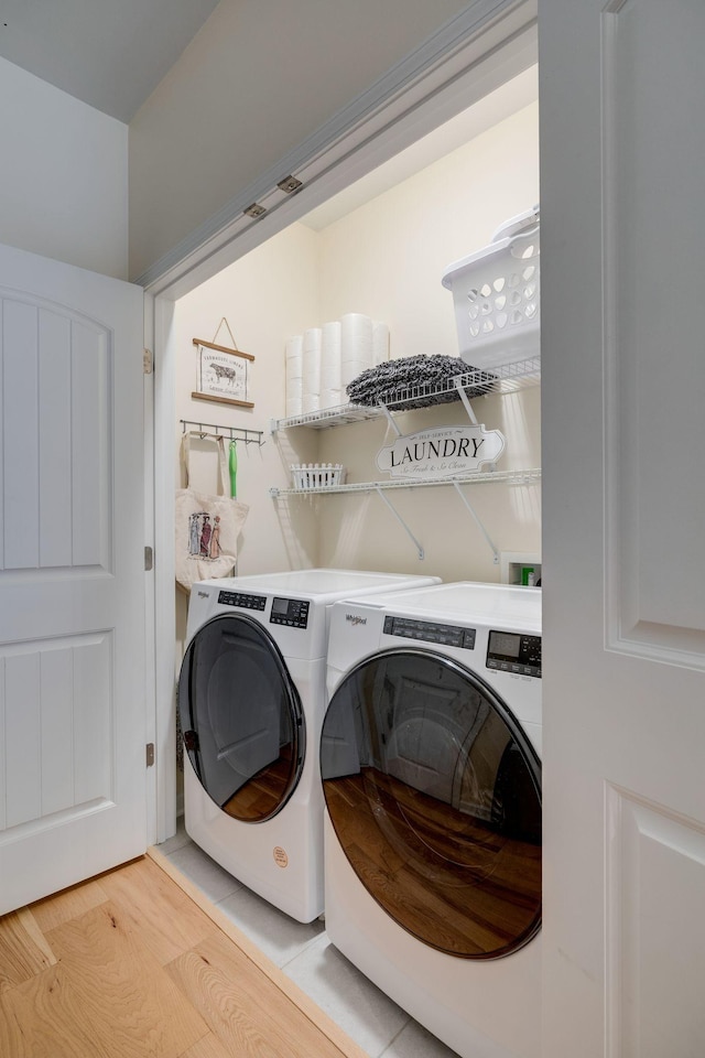979 Carnation Dr, Spring Hill, TN 37174 - laundry room featuring independent washer and dryer and light wood-style floors