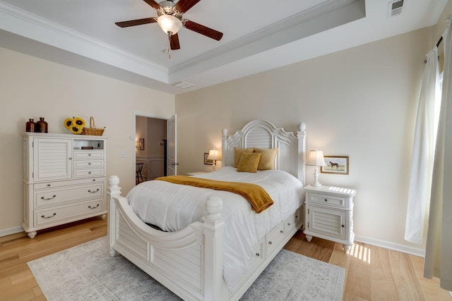 979 Carnation Dr, Spring Hill, TN 37174 - bedroom with light wood-type flooring, crown molding, a raised ceiling, baseboards, and ceiling fan