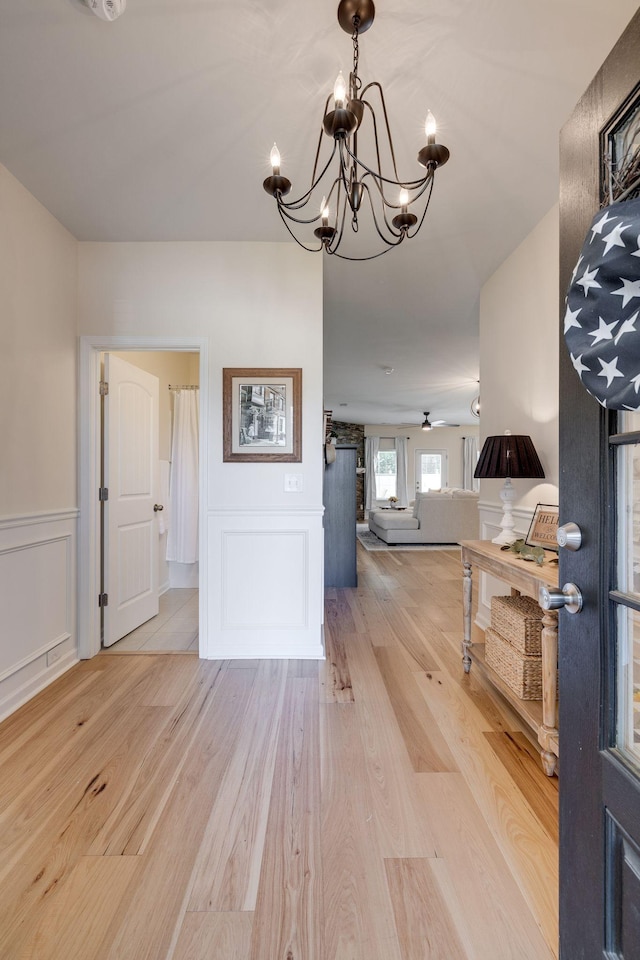 979 Carnation Dr, Spring Hill, TN 37174 - foyer entrance with a chandelier, wood finished floors, a decorative wall, and wainscoting