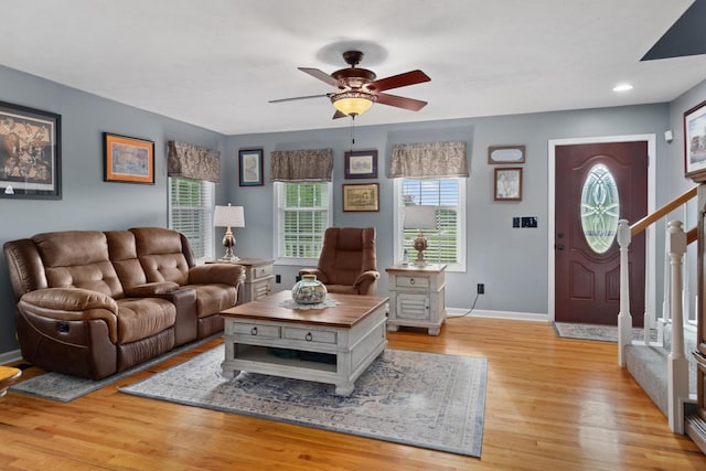 6928 Hoover Mason Ln, Mount Pleasant, TN 38474 - living room featuring a ceiling fan, light wood finished floors, baseboards, and stairway