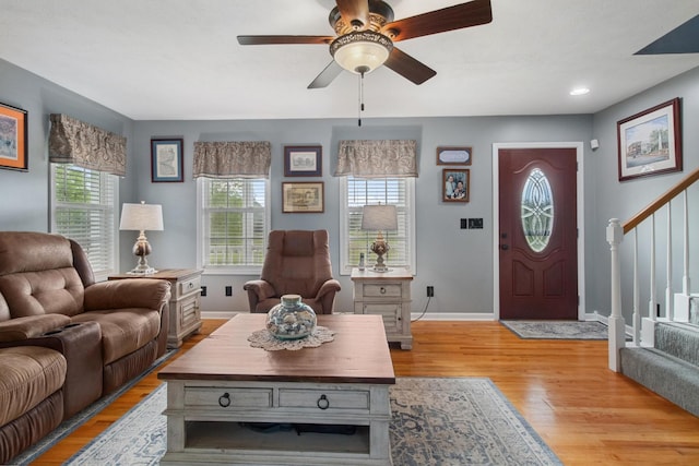 6928 Hoover Mason Ln, Mount Pleasant, TN 38474 - living area featuring stairs, light wood-style floors, a ceiling fan, and baseboards