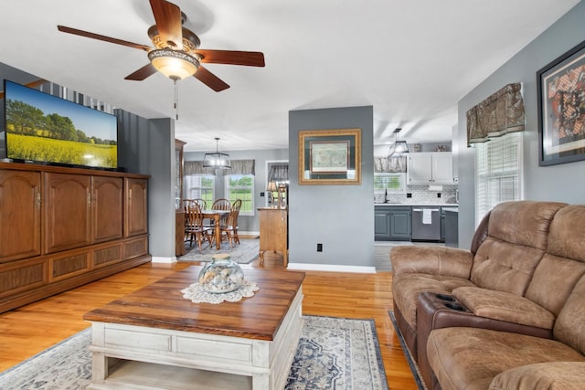 6928 Hoover Mason Ln, Mount Pleasant, TN 38474 - living area featuring light wood-type flooring, a ceiling fan, and baseboards