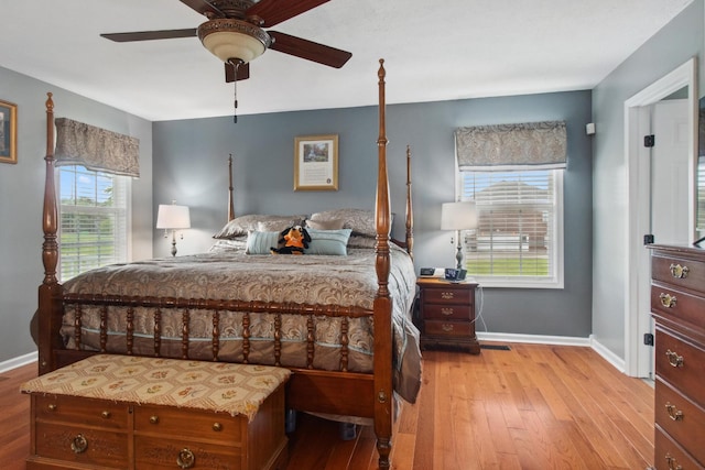 6928 Hoover Mason Ln, Mount Pleasant, TN 38474 - bedroom with multiple windows, wood finished floors, and baseboards