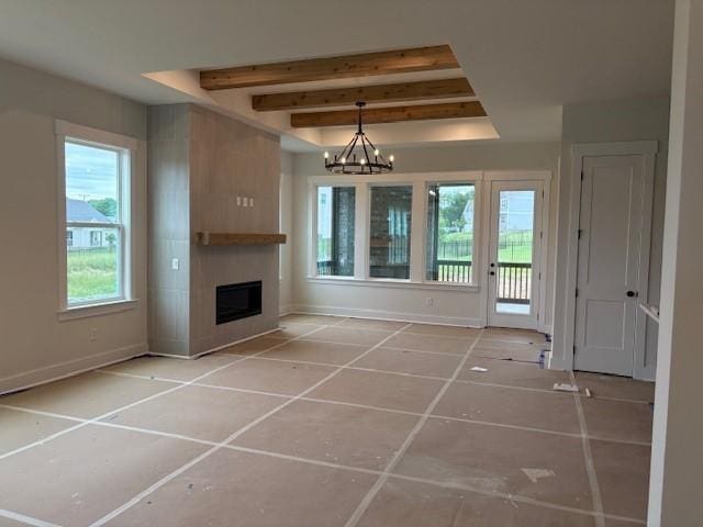 4605 Hessey Rd, Mount Juliet, TN 37122 - unfurnished living room with a large fireplace, a chandelier, beam ceiling, baseboards, and tile patterned floors