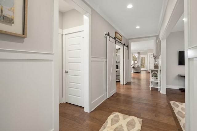 4605 Hessey Rd, Mount Juliet, TN 37122 - hallway featuring a barn door, wood finished floors, recessed lighting, and ornamental molding