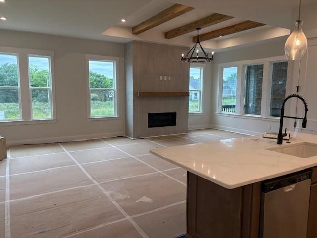 4605 Hessey Rd, Mount Juliet, TN 37122 - kitchen with a sink, stainless steel dishwasher, beamed ceiling, a fireplace, and baseboards