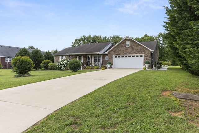 147 Crimson Dr, Winchester, TN 37398 - single story home featuring a garage, a front yard, concrete driveway, and brick siding