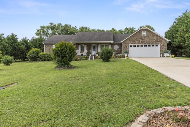 147 Crimson Dr, Winchester, TN 37398 - ranch-style home featuring a garage, a front lawn, covered porch, concrete driveway, and brick siding