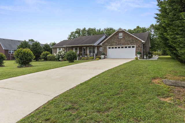 147 Crimson Dr, Winchester, TN 37398 - ranch-style home featuring an attached garage, a front lawn, concrete driveway, and brick siding