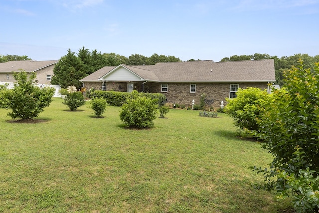 147 Crimson Dr, Winchester, TN 37398 - back of house with a yard and brick siding