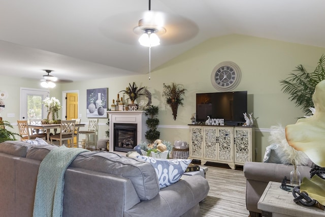 147 Crimson Dr, Winchester, TN 37398 - living area with ceiling fan, lofted ceiling, and a glass covered fireplace