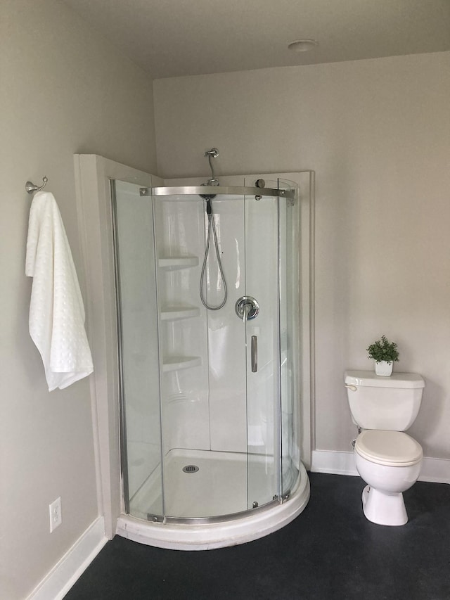 1402 Clarke St, Old Hickory, TN 37138 - bathroom with baseboards, a stall shower, and toilet