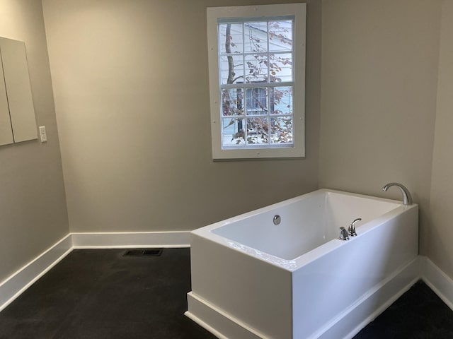 1402 Clarke St, Old Hickory, TN 37138 - bathroom featuring baseboards and a garden tub