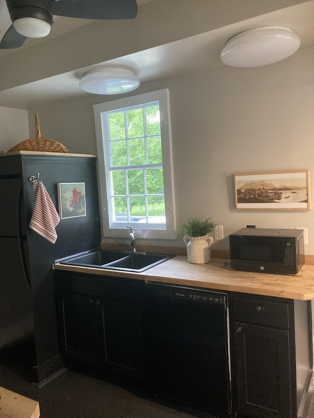 1402 Clarke St, Old Hickory, TN 37138 - kitchen with black appliances, a sink, light countertops, and dark cabinets