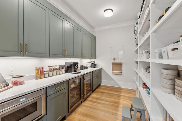 1040B Battery Ln E, Nashville, TN 37220 - kitchen with stainless steel microwave, beverage cooler, light countertops, light wood-style floors, and baseboards