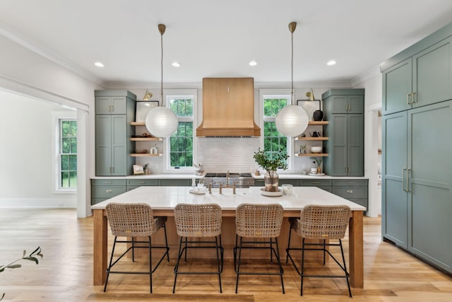 1040B Battery Ln E, Nashville, TN 37220 - kitchen with open shelves, premium range hood, green cabinets, light countertops, and backsplash