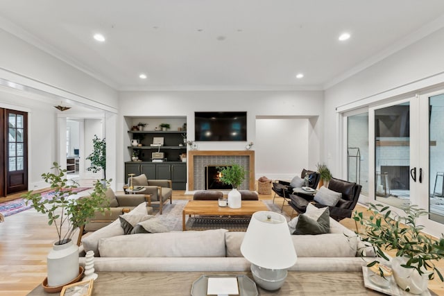 1040B Battery Ln E, Nashville, TN 37220 - living room with crown molding, recessed lighting, a tiled fireplace, and wood finished floors