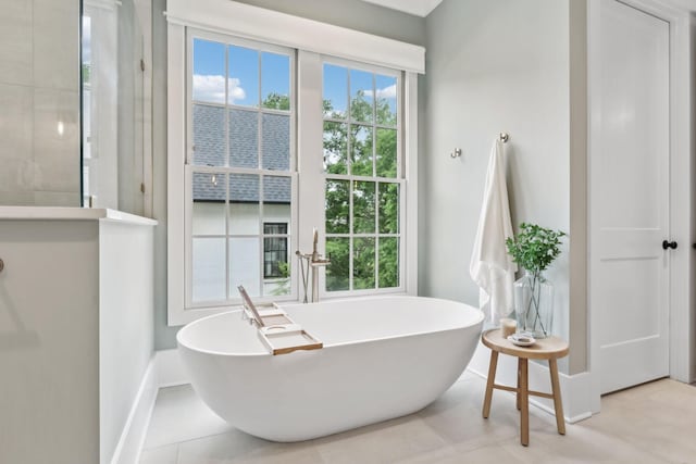 1040B Battery Ln E, Nashville, TN 37220 - full bathroom featuring baseboards, a soaking tub, and tile patterned flooring