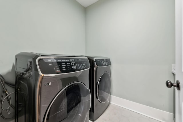 1040B Battery Ln E, Nashville, TN 37220 - laundry area featuring washing machine and clothes dryer and baseboards