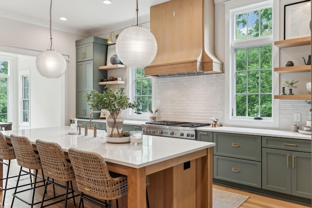 1040B Battery Ln E, Nashville, TN 37220 - kitchen featuring open shelves, custom range hood, decorative backsplash, a breakfast bar, and pendant lighting
