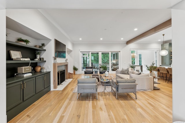 1040B Battery Ln E, Nashville, TN 37220 - living area featuring light wood-type flooring, a fireplace, healthy amount of natural light, crown molding, and recessed lighting