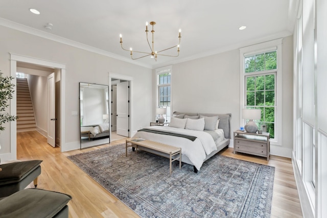1040B Battery Ln E, Nashville, TN 37220 - bedroom featuring a chandelier, light wood-type flooring, ornamental molding, baseboards, and recessed lighting