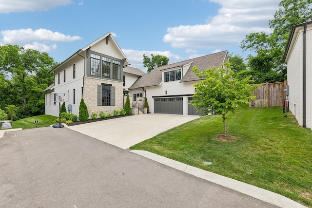 1040B Battery Ln E, Nashville, TN 37220 - modern home with a garage, concrete driveway, stone siding, and roof with shingles