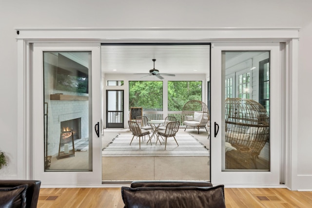 1040B Battery Ln E, Nashville, TN 37220 - entryway featuring a ceiling fan, a brick fireplace, and wood finished floors