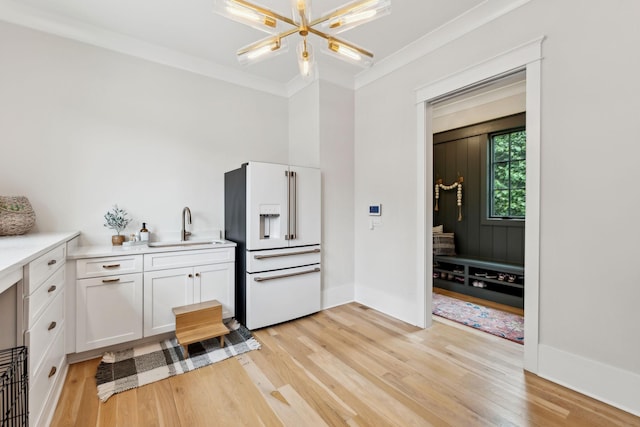 1040B Battery Ln E, Nashville, TN 37220 - kitchen with high end white refrigerator, a sink, white cabinetry, light wood finished floors, and light countertops