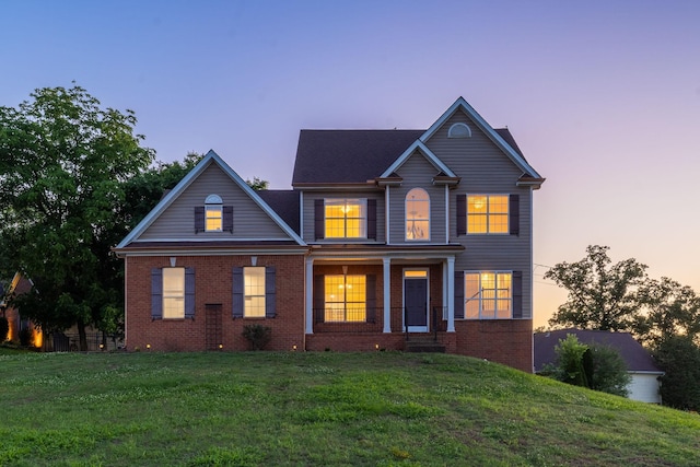100 Nancy Ct, Hermitage, TN 37076 - view of front of house featuring brick siding, a front yard, and a porch