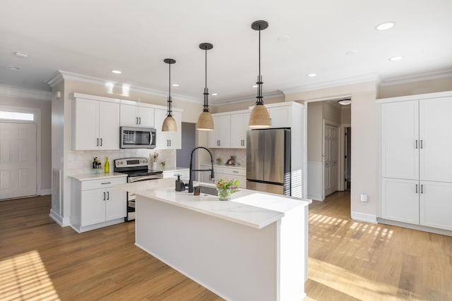 100 Nancy Ct, Hermitage, TN 37076 - kitchen featuring stainless steel appliances, crown molding, recessed lighting, white cabinets, and tasteful backsplash