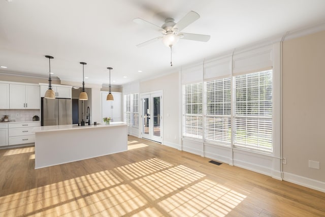 100 Nancy Ct, Hermitage, TN 37076 - kitchen featuring freestanding refrigerator, a sink, french doors, crown molding, and plenty of natural light