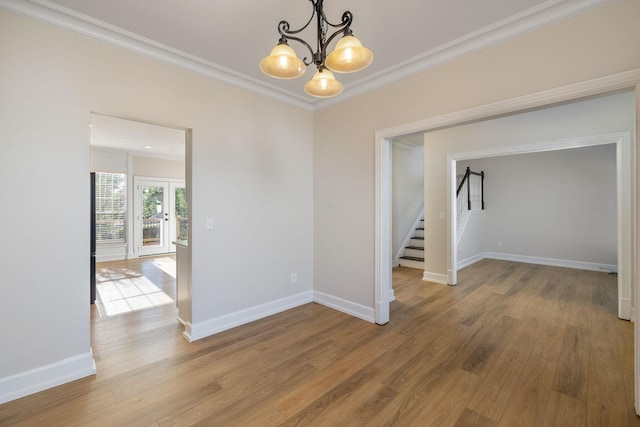 100 Nancy Ct, Hermitage, TN 37076 - empty room featuring stairway, a chandelier, ornamental molding, wood finished floors, and baseboards