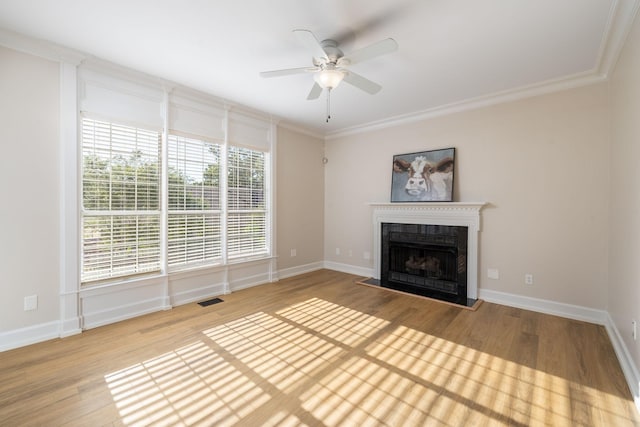 100 Nancy Ct, Hermitage, TN 37076 - unfurnished living room with wood finished floors, a fireplace with raised hearth, ceiling fan, ornamental molding, and baseboards