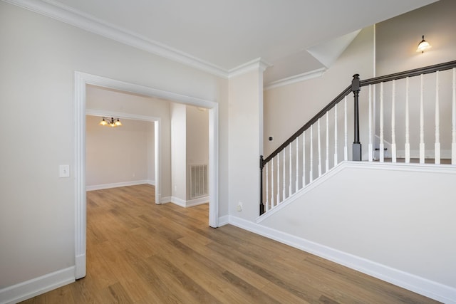 100 Nancy Ct, Hermitage, TN 37076 - corridor with ornamental molding, wood finished floors, baseboards, stairway, and a chandelier