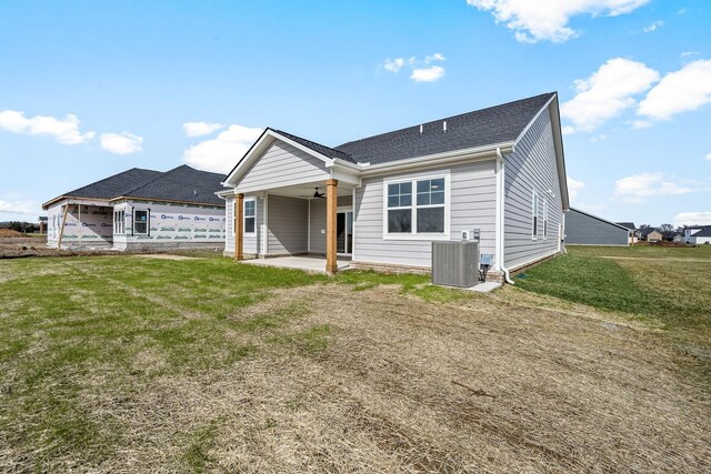 0 Stonehorn Dr, Bell Buckle, TN 37020 - view of front of house featuring central air condition unit, a patio, a front lawn, ceiling fan, and roof with shingles