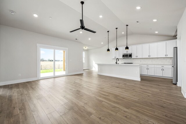 0 Stonehorn Dr, Bell Buckle, TN 37020 - unfurnished living room with a ceiling fan, wood finished floors, a sink, recessed lighting, and high vaulted ceiling