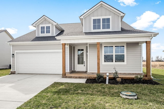 0 Stonehorn Dr, Bell Buckle, TN 37020 - view of front of property with covered porch, a front yard, a garage, concrete driveway, and a shingled roof