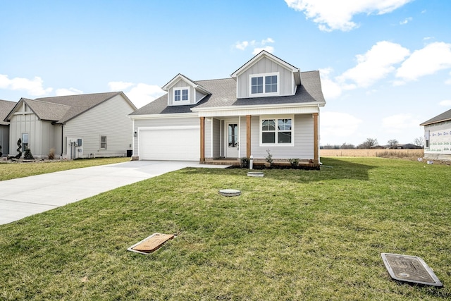 0 Stonehorn Dr, Bell Buckle, TN 37020 - view of front of house featuring concrete driveway, a front yard, covered porch, a garage, and board and batten siding