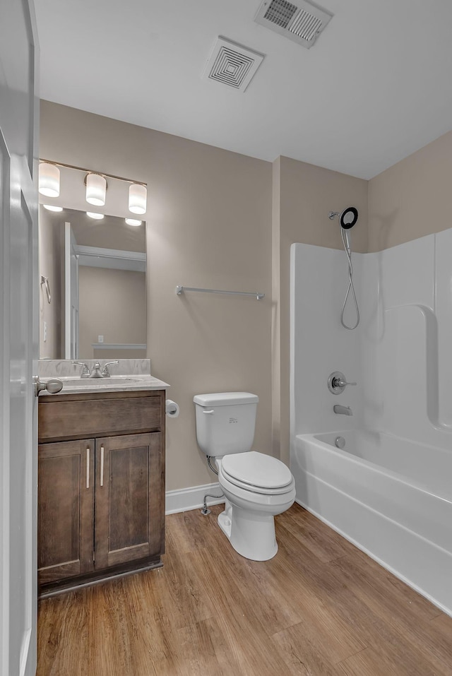 421 Willis Way, Columbia, TN 38401 - bathroom featuring toilet, wood finished floors, vanity, bathtub / shower combination, and baseboards