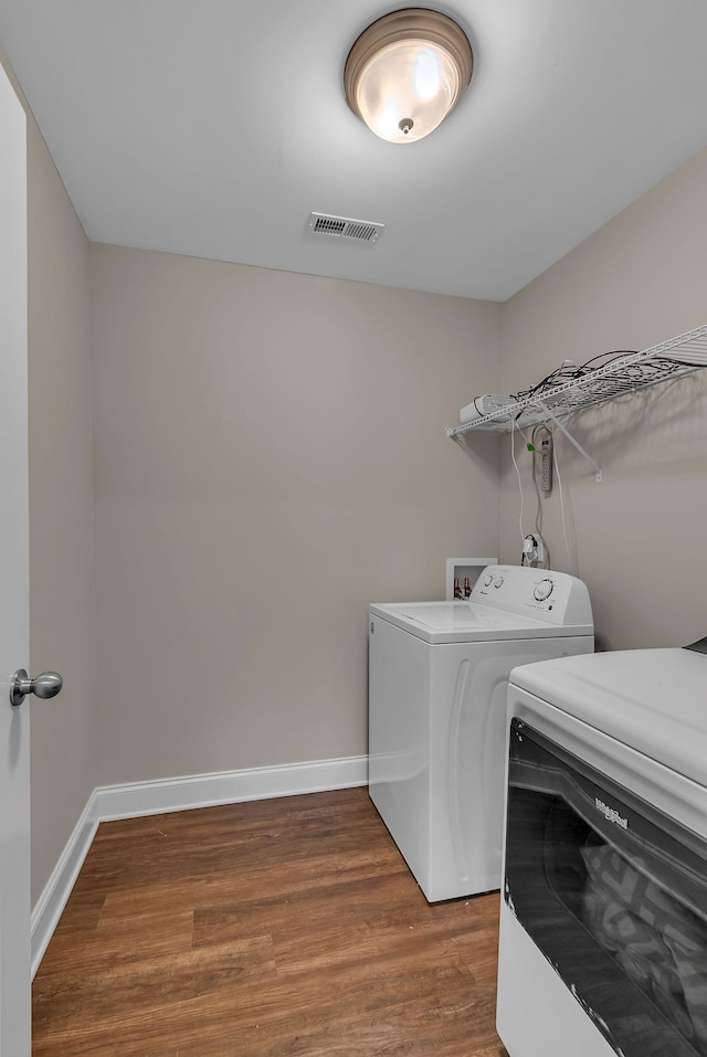 421 Willis Way, Columbia, TN 38401 - laundry room with washing machine and dryer, wood finished floors, and baseboards