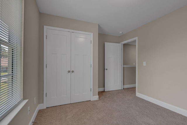 421 Willis Way, Columbia, TN 38401 - unfurnished bedroom with carpet floors, baseboards, and a closet
