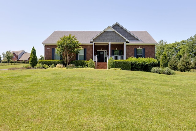 3715 Petty Ln, Columbia, TN 38401 - view of front of house featuring a front lawn, covered porch, and brick siding