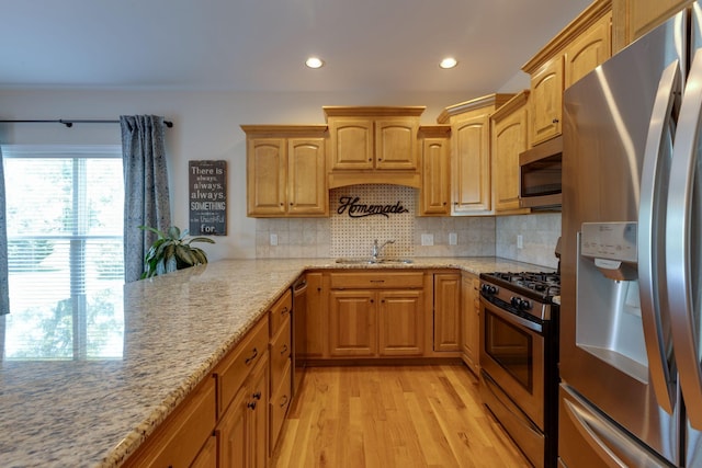 3715 Petty Ln, Columbia, TN 38401 - kitchen with appliances with stainless steel finishes, a sink, light stone countertops, recessed lighting, and light wood-type flooring
