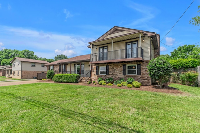 520 Almaville Rd, Smyrna, TN 37167 - split level home with french doors, a balcony, a front yard, and brick siding