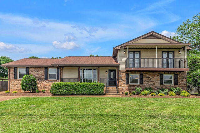 520 Almaville Rd, Smyrna, TN 37167 - tri-level home with a balcony, brick siding, french doors, and roof with shingles